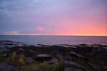 Fototapeta na wymiar Warm and cold sunset view at Kallo Island in Pori, Finland.