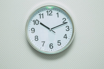 Time Punctual Second Minute Hour Concept . Wall white clock and shelf at abstract white background . close up of an office clock on white background with clipping path