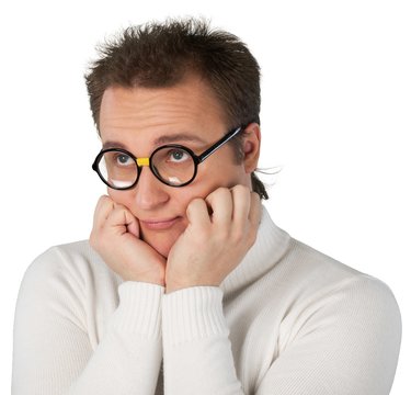 Portrait of young businessman with glasses in white sweater with