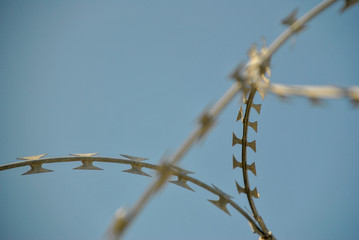 new modern barbed wire against the sky