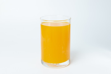 Orange juice in the glass on white background isolate.