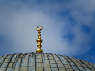 Fototapeta na wymiar Crescent moon at a top of a mosque of Hagia Sophia in Istanbul. Islamic symbol clouse up