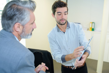 portrait of two businessmen in office