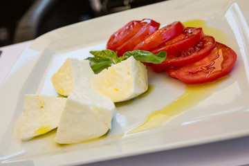Buffalo mozzarella, tomato and basil salad dressed with extra virgin olive oil.