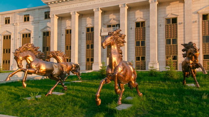 Beautiful sculptures of horses timelapse hyperlapse in front of Astana Opera Theater