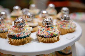 Roller Derby Skating Party Cupcakes on a Carrier with Disco Ball Garnish