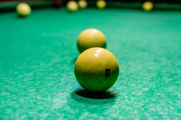 Balls on the green cloth. Russian billiard