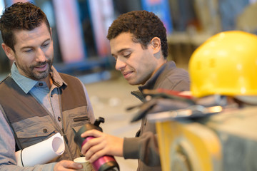 factory construction designer showing sample products