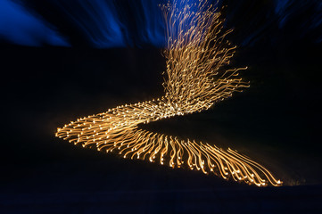 Light painting abstract background. Blue and yellow light painting, long exposure, ripples and...
