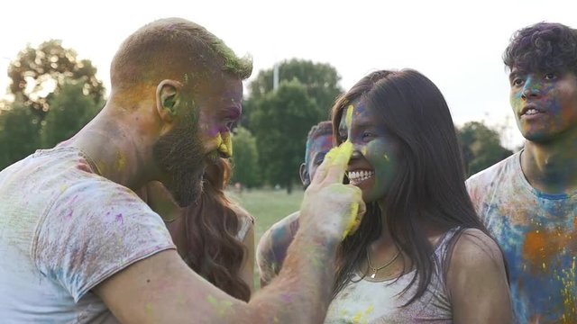 Group of friends playing with holi colors, video concepts about friendship and lifestyle