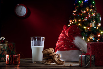 close up view of glass of milk with cookies on color back