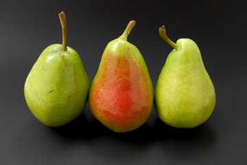 Fototapeta na wymiar three pears isolated on black background