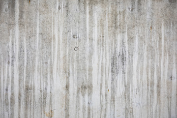Fototapeta na wymiar Wet concrete wall at rainy day