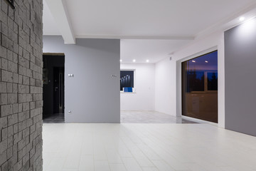 Living room with new laminated floor and decorative wall