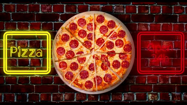 An image of a pizzeria sign with luminous neon letters. 