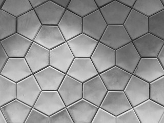Geometrically shaped concrete wall tiles.