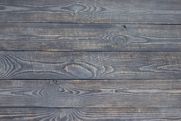 Dark background of wooden texture boards with paint residues. Horizontal.