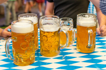 Close-up of bavarian beer glasses 1 liter Beer on table decoation at the Octoberfest