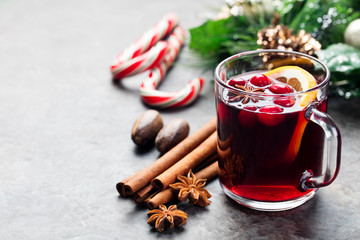 Mulled red wine with spices, orange slices. New year and Christmas background. Copy space.