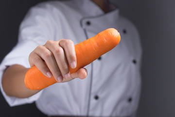 Cooks are chopped red peppers to cook