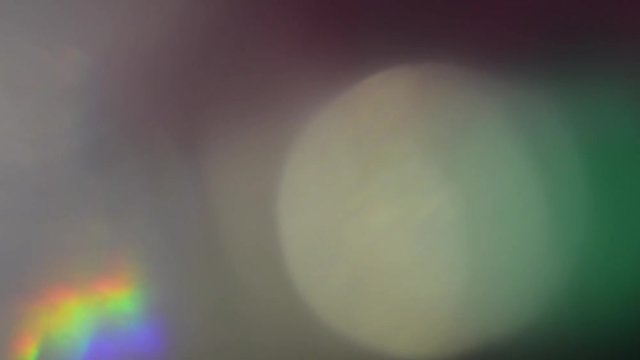 Light transitions and lens flare wipes with silver and holographic iridescent bokeh.