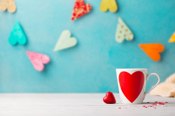 Romantic drink, coffee, latte, cappuccino with whipped cream and chocolate hearts. Blue background. Copy space.