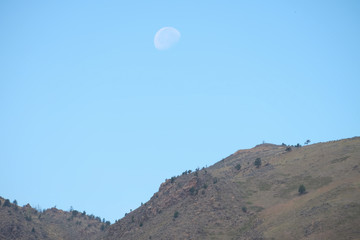 Fototapeta na wymiar Big Bright Moon over the Mountain Landscape