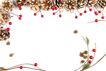 A top view of a christmas ornaments: pine cones awith red berries and curved twig on white background