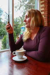 Woman, coffee and phone.