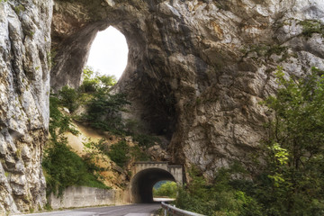 Tunnel on the road by Piva river canyon in the northern Montenegro.