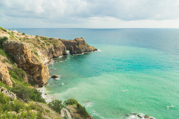 View of the sea from the cliff. Blue bay