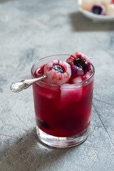 Red halloween cocktail with eye