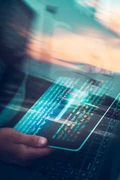 Hacker using computer, smartphone and coding to steal password and private data