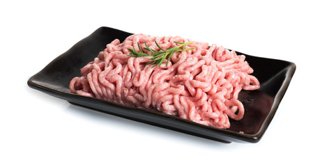 Raw meat. Minced pork in a plate isolated on white background
