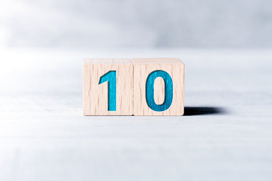 Number 10 Formed By Wooden Blocks On A White Table