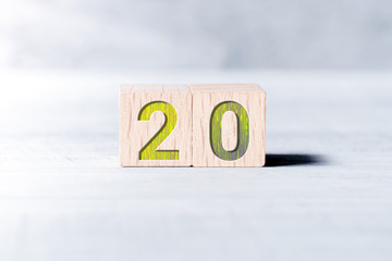 Number 20 Formed By Wooden Blocks On A White Table