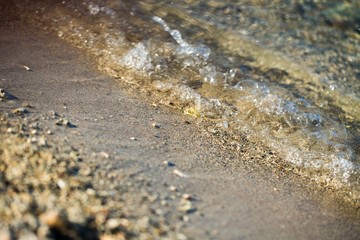 Clear Sea Water with a Pebble Beach on the Coastline