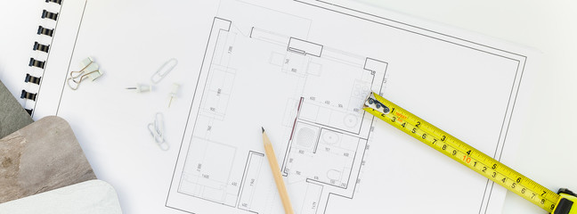 Interior designer table workplace with house plan