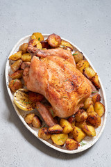 Whole roasted chicken with potato