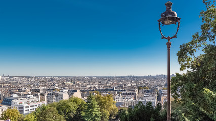 Fototapeta na wymiar Paris, panorama of the city, from Montmartre hill, with a vintage lamppost 