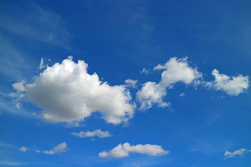 Naklejka na ściany i meble Pure White Fluffy Cumulus Clouds Floating on Vivid Blue Sky of Peru, South America