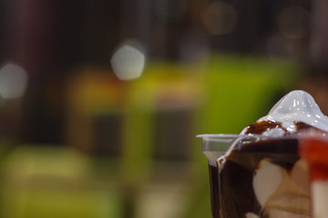 Sundae with chocolate and strawberry cream on cafe