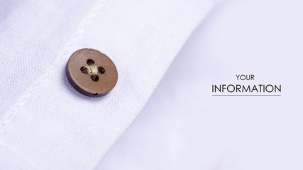 White shirt button fabric macro material clothes detail pattern on blur background