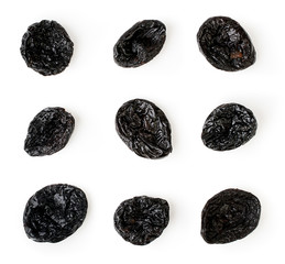 Prunes laid out on a white, isolated. The view from the top.