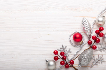Silver and red christmas gifts on white wooden background. Top view