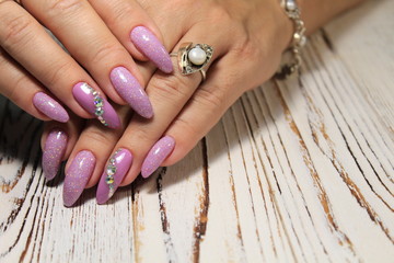 glamorous beautiful manicure on a trendy texture background