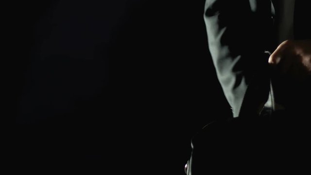 Male official buying weapon from dealer, illegal means of self-defense, closeup