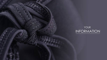 Obraz premium Black swimsuit bra push up seams of a string laces pattern macro background