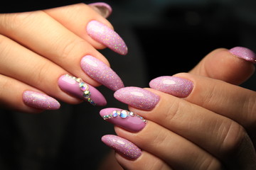 glamorous manicure of nails on beautiful female hands