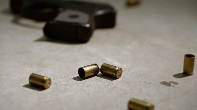 Police Crime Scene With Handgun And Bullet Casing On The Concrete. 